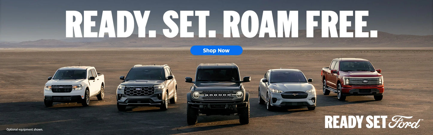 Ford trucks in a desert landscape with 'Ready. Set. Roam Free.' text and 'Shop Now' button.